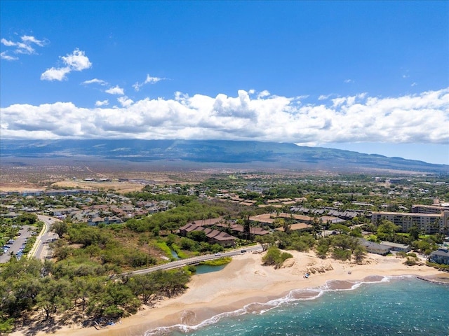 aerial view featuring a water and mountain view and a beach view