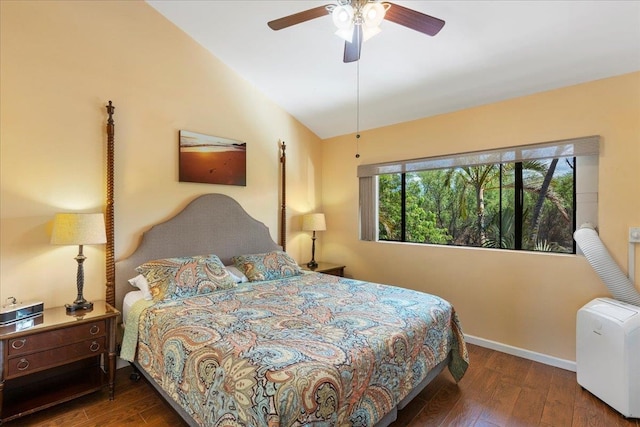 bedroom with lofted ceiling, dark hardwood / wood-style floors, and ceiling fan