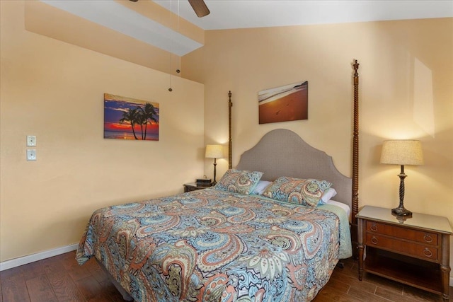 bedroom with lofted ceiling, ceiling fan, and dark wood-type flooring