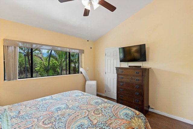 bedroom featuring lofted ceiling, dark wood-type flooring, and ceiling fan