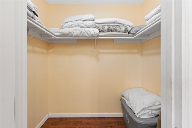 walk in closet featuring dark hardwood / wood-style floors