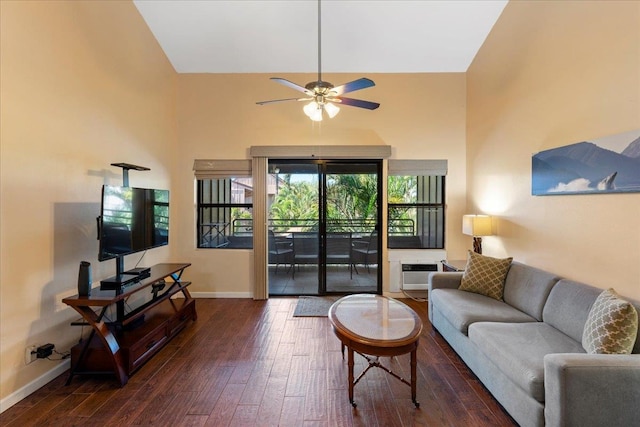 living room featuring dark hardwood / wood-style flooring, ceiling fan, a wall mounted air conditioner, and high vaulted ceiling