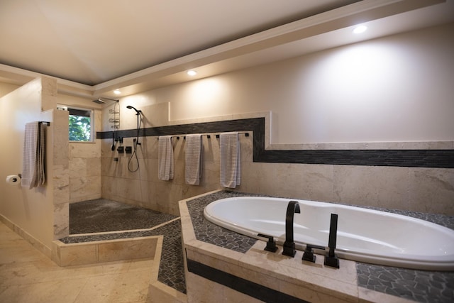 bathroom with shower with separate bathtub