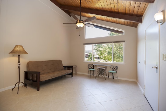 sitting room with vaulted ceiling with beams, ceiling fan, light tile patterned flooring, and wooden ceiling