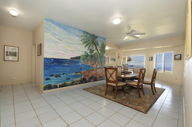 tiled dining area with ceiling fan