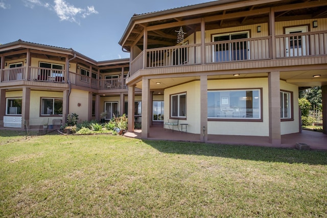 rear view of house with a yard