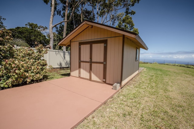 view of outdoor structure with a lawn