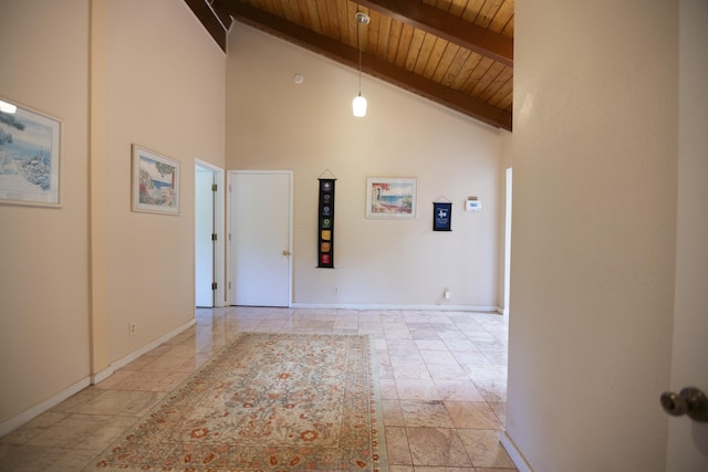 hall with beam ceiling, wood ceiling, and high vaulted ceiling