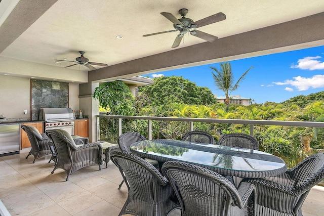 view of patio with ceiling fan, an outdoor kitchen, and a grill