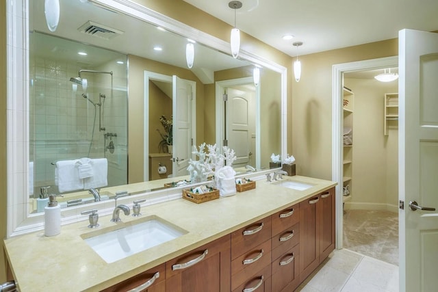 bathroom featuring vanity and a shower with shower door