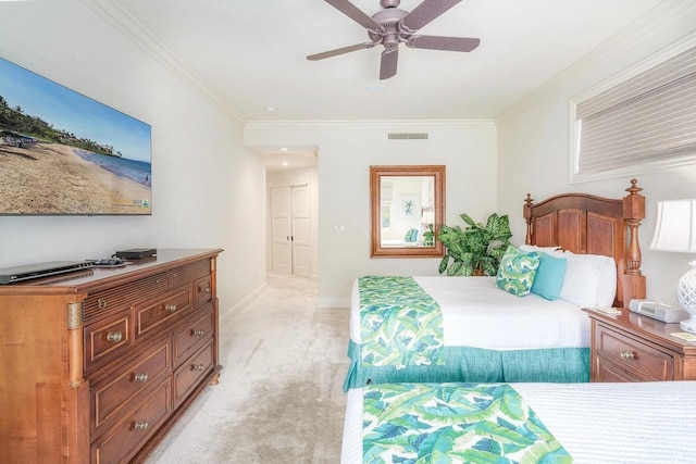 bedroom featuring crown molding, light colored carpet, and ceiling fan