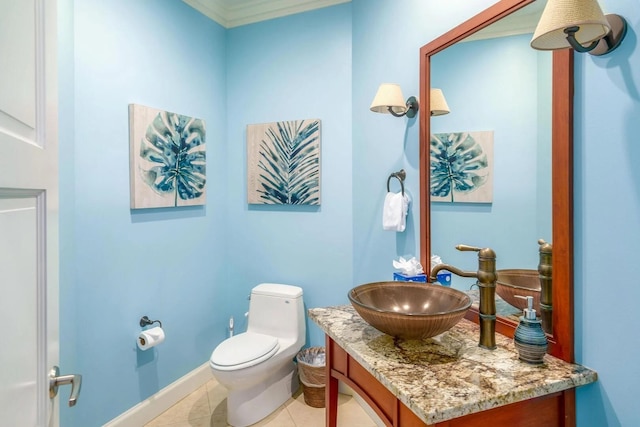 bathroom with vanity, tile patterned flooring, and toilet