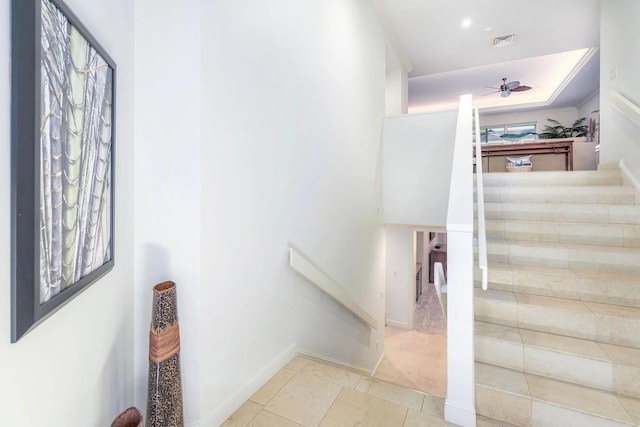 staircase with ceiling fan