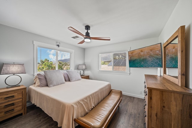 bedroom featuring visible vents, baseboards, dark wood-type flooring, and ceiling fan