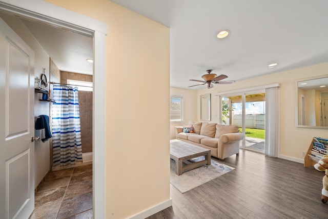 living room featuring dark wood finished floors, recessed lighting, a ceiling fan, and baseboards