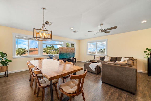 dining area featuring visible vents, plenty of natural light, baseboards, and dark wood-style floors