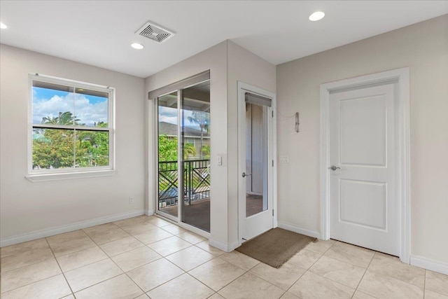 entryway with light tile patterned floors