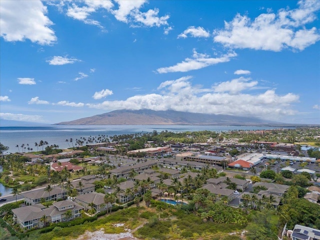 drone / aerial view with a water and mountain view