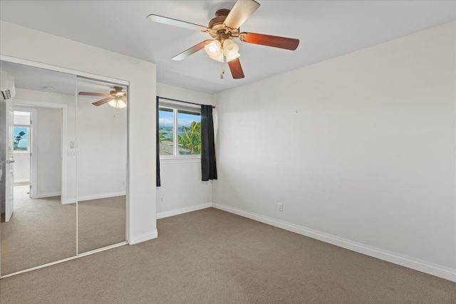 unfurnished bedroom featuring carpet, a closet, and ceiling fan