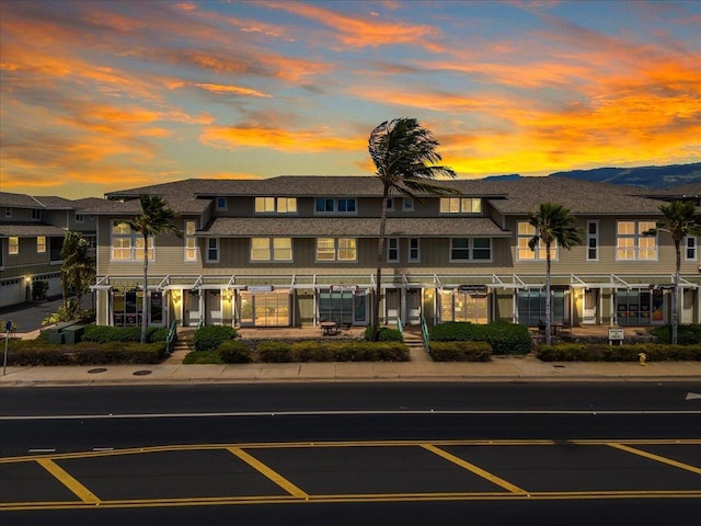 view of outdoor building at dusk