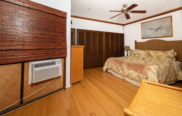 unfurnished bedroom with ornamental molding, an AC wall unit, wood-type flooring, and ceiling fan