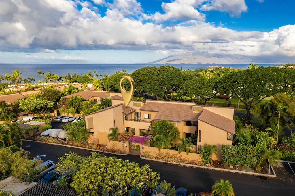 birds eye view of property with a water view