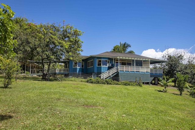 698 Kaupakalua Rd Unit A, Haiku, HI 96708 - rear view of house with a lawn and stairs