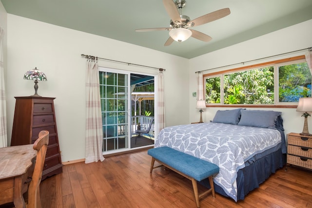 698 Kaupakalua Rd Unit A, Haiku, HI 96708 - bedroom featuring access to exterior, wood finished floors, and a ceiling fan