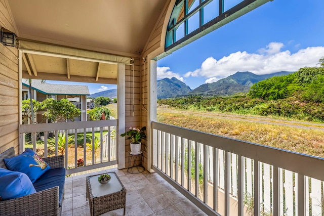 balcony featuring a mountain view