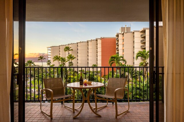 view of balcony at dusk