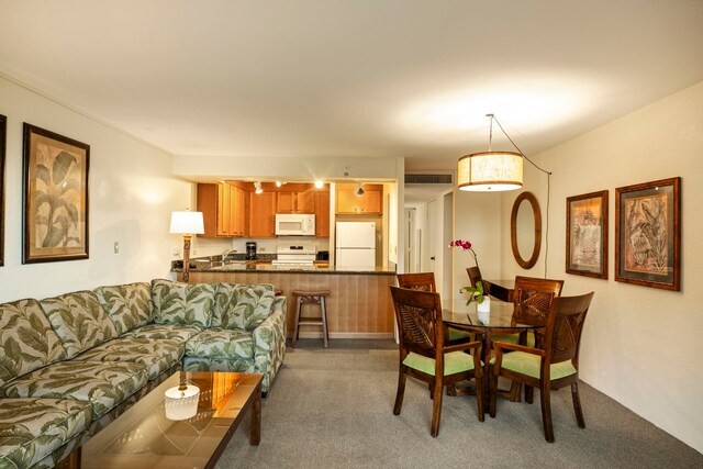 dining area with carpet and sink