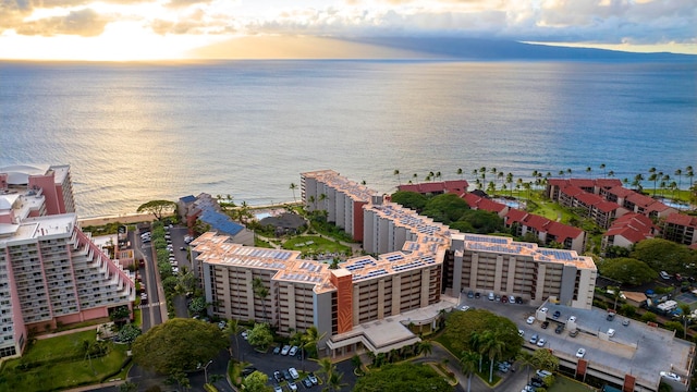 aerial view at dusk with a water view