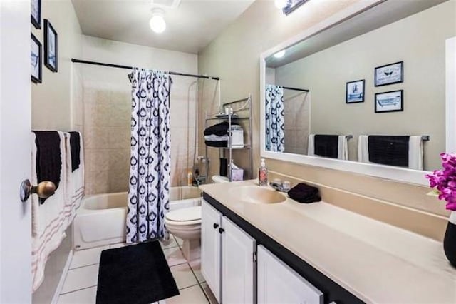 full bathroom featuring shower / tub combo with curtain, vanity, toilet, and tile patterned flooring