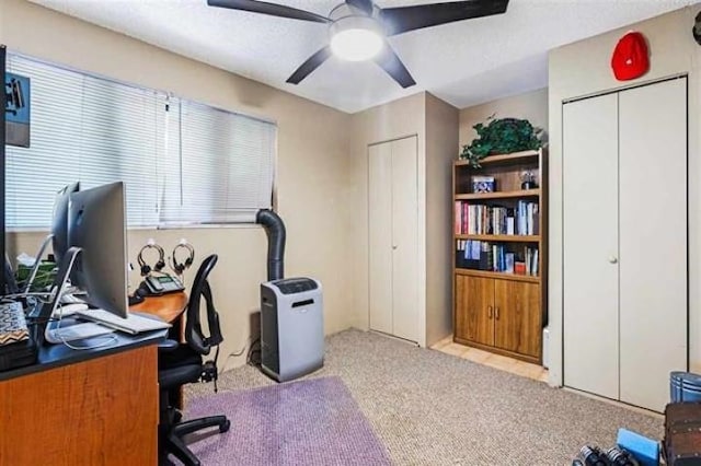 carpeted office with ceiling fan