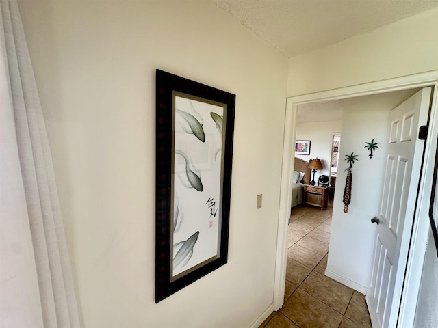 hallway with light tile patterned floors