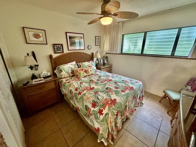 bedroom featuring light tile patterned flooring and ceiling fan