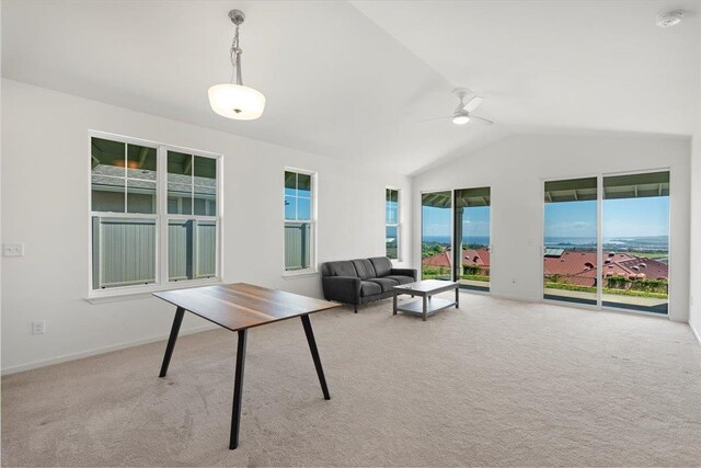 carpeted living room with lofted ceiling, baseboards, a ceiling fan, and a healthy amount of sunlight