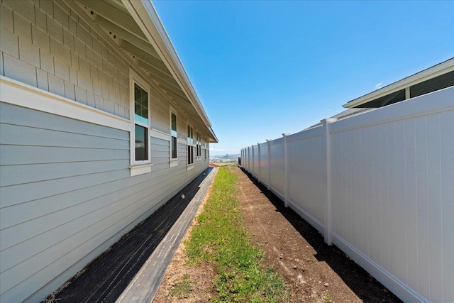 view of side of property with fence