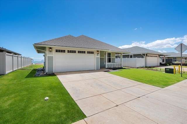ranch-style house featuring an attached garage, driveway, fence, and a front lawn