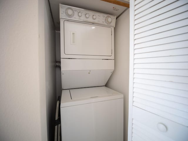 laundry room featuring stacked washer / dryer