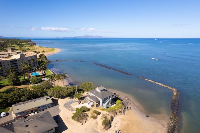 birds eye view of property with a beach view and a water view