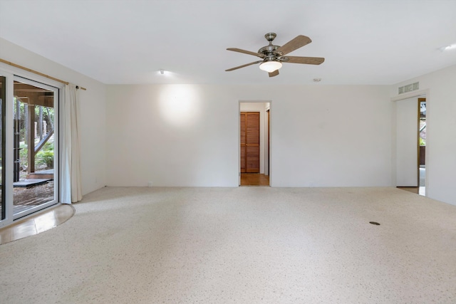 unfurnished room featuring visible vents and ceiling fan