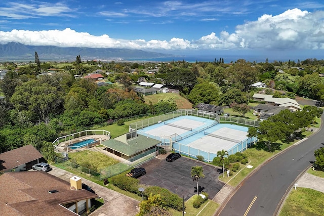 birds eye view of property with a mountain view