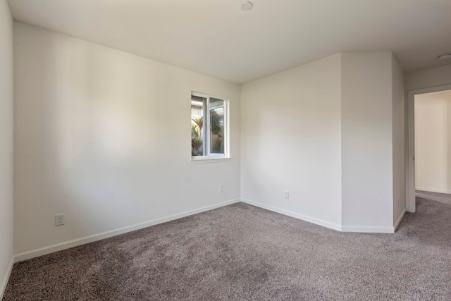 unfurnished room featuring carpet flooring