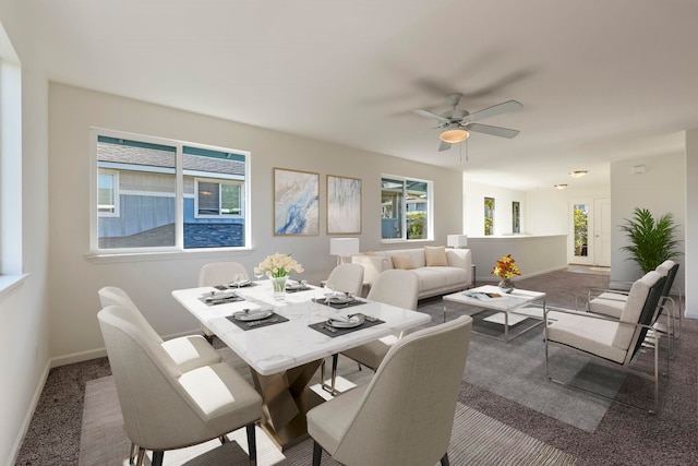 carpeted dining space with plenty of natural light and ceiling fan