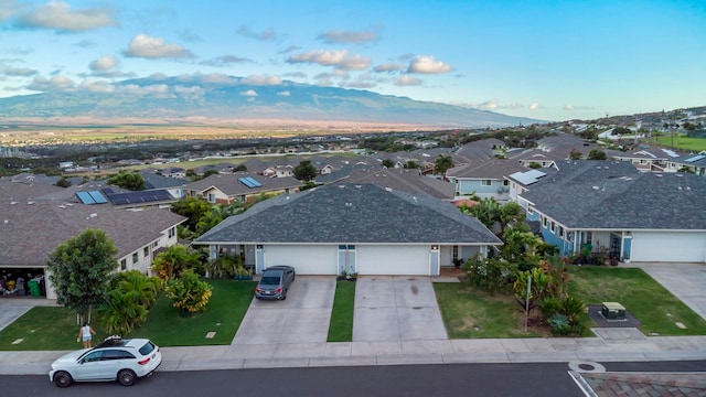 birds eye view of property featuring a mountain view