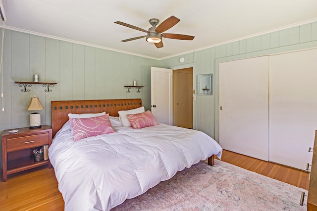 219 Ekoa Pl, Wailuku, HI 96763 - bedroom featuring ornamental molding, wood finished floors, a closet, and ceiling fan