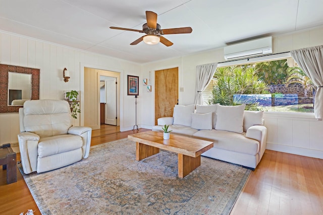 219 Ekoa Pl, Wailuku, HI 96763 - living room featuring a wall unit AC, ceiling fan, wood finished floors, and crown molding
