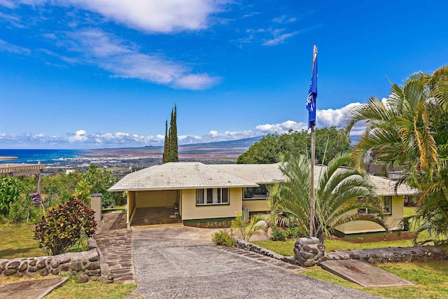 219 Ekoa Pl, Wailuku, HI 96763 - view of front facade with asphalt driveway and a carport