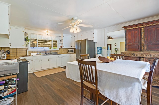 219 Ekoa Pl, Wailuku, HI 96763 - dining area featuring ceiling fan and dark wood-type flooring